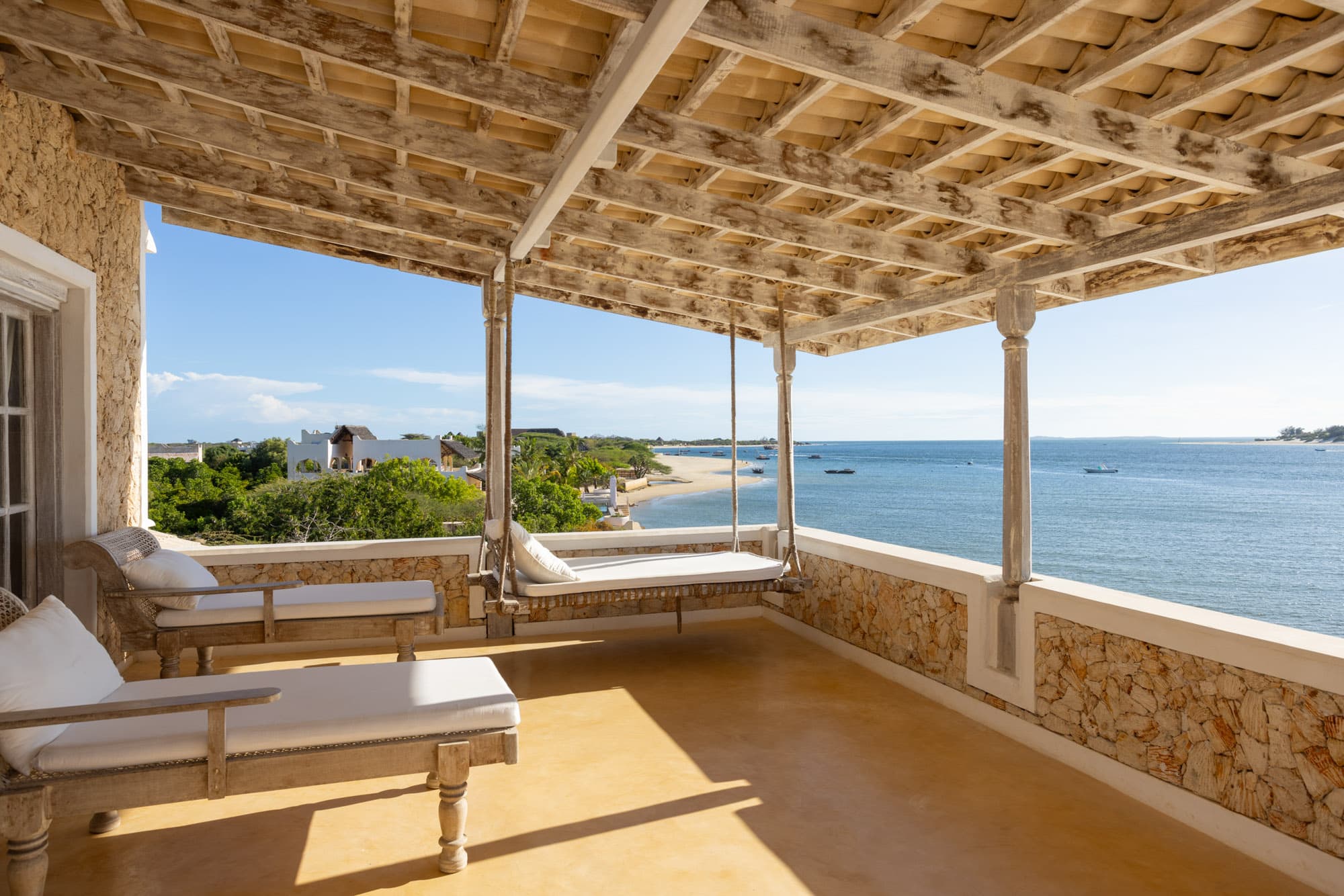 Rooftop terrace daybeds overlooking the beach